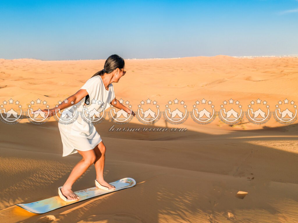 Adventure sandboarding in Moroccan desert dunes